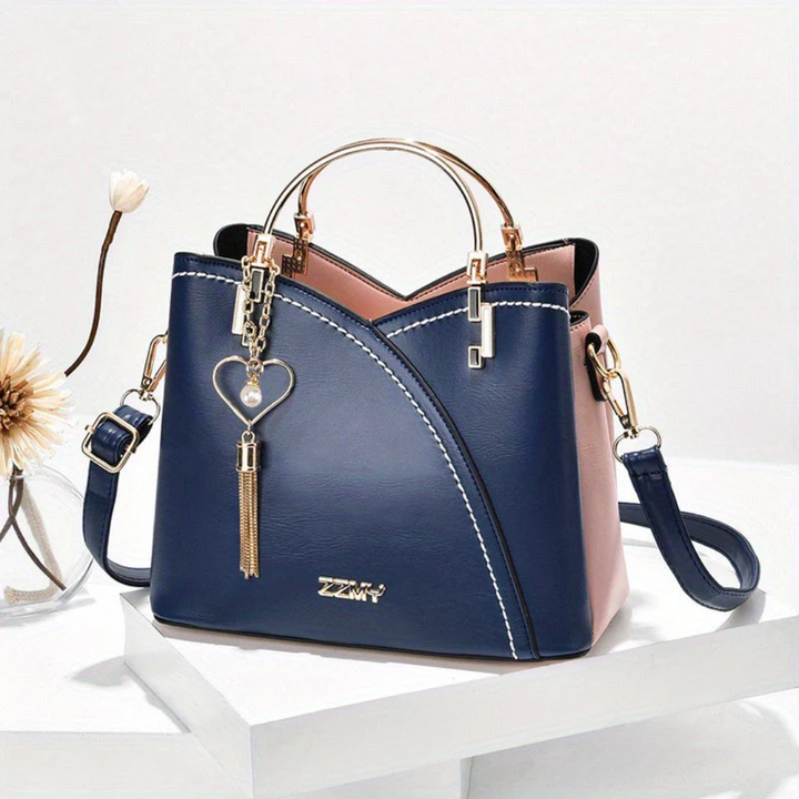 Fashionable women's faux leather bag, versatile for office to evening.