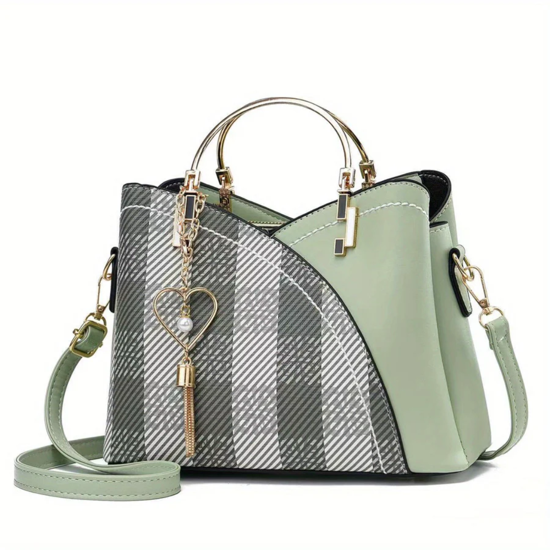 Stylish black faux leather handbag, elegant and practical for women.