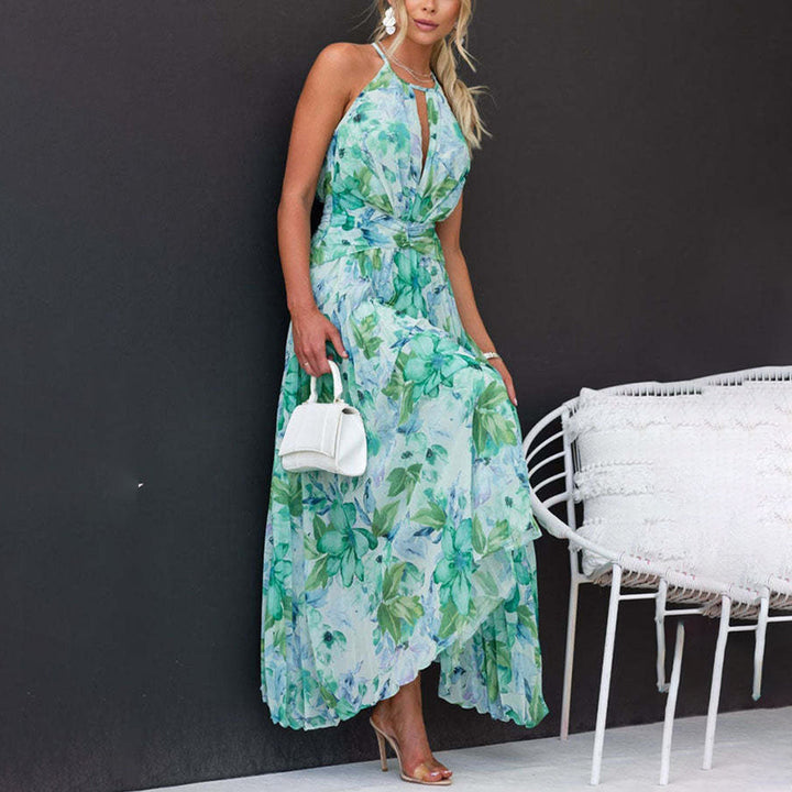 Back view of a chic green floral halter maxi dress, showcasing its elegant flowy design for summer.
