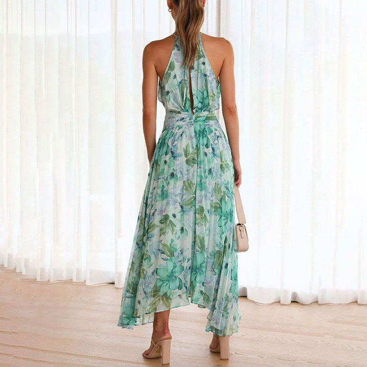 Flowy green floral maxi dress for women, ideal for casual summer outings or elegant beach fashion.