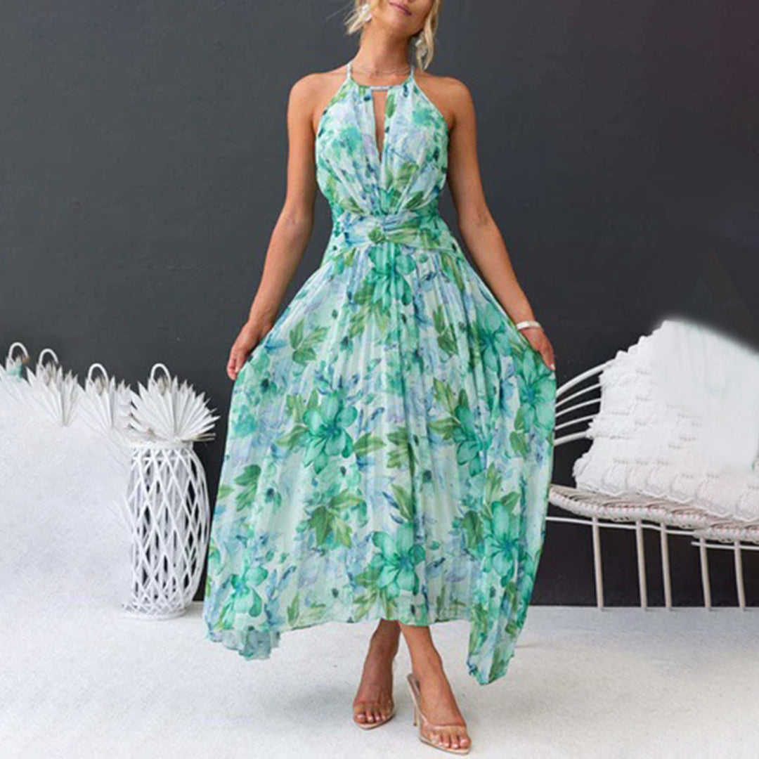 Close-up of the vibrant green floral pattern on a women's elegant summer maxi dress fabric.
