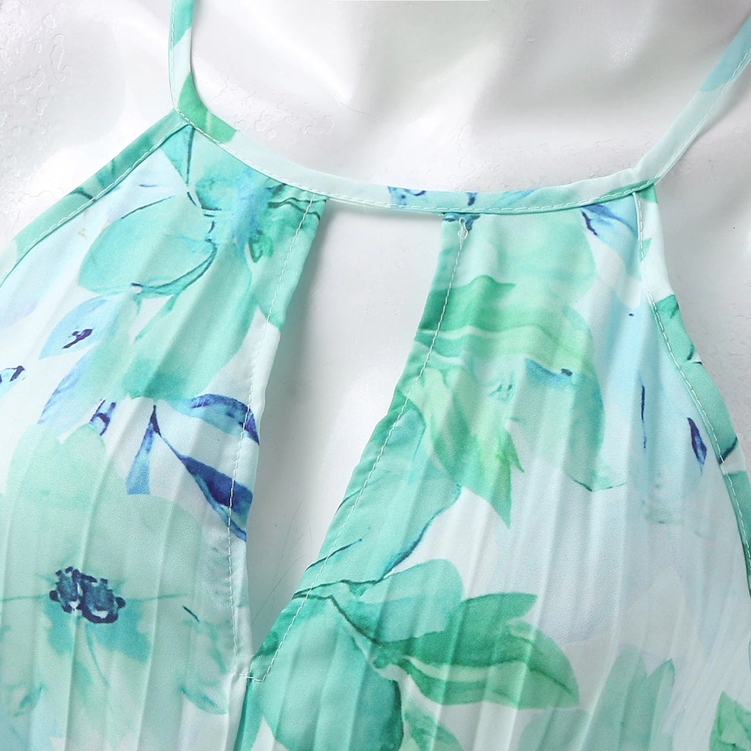 Woman wearing an elegant green floral maxi dress, perfect for effortless summer fashion and comfort.