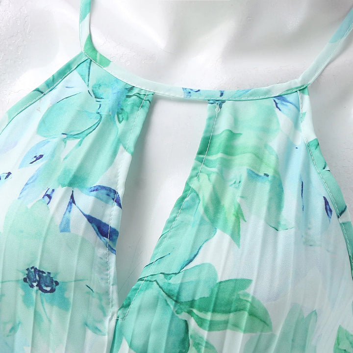 Woman wearing an elegant green floral maxi dress, perfect for effortless summer fashion and comfort.