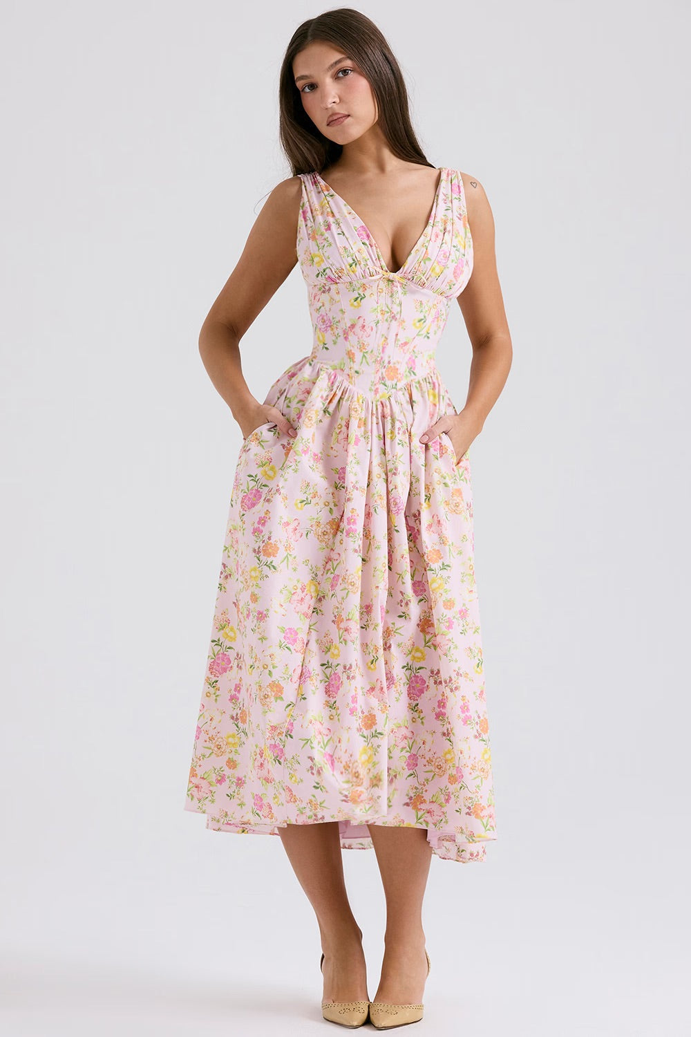 Close-up of vibrant floral pattern on an elegant women's summer A-line dress with hidden pockets.