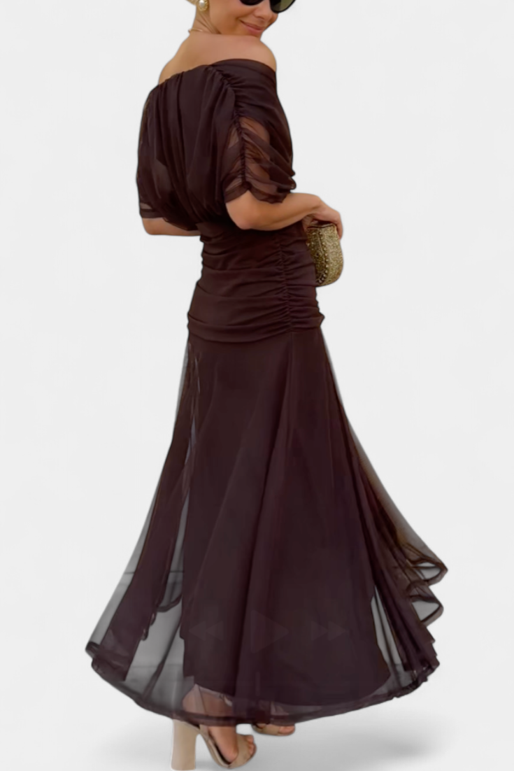 Flowy off-shoulder summer maxi dress with floral pattern.