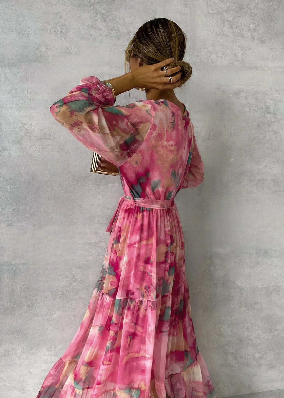 Pink floral wrap maxi dress for women, long-sleeve design. Feminine & elegant, ideal for parties and events.