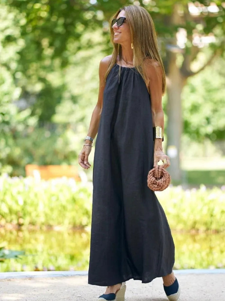 Black elegant women's halter maxi dress, a versatile summer dress for parties and special occasions.