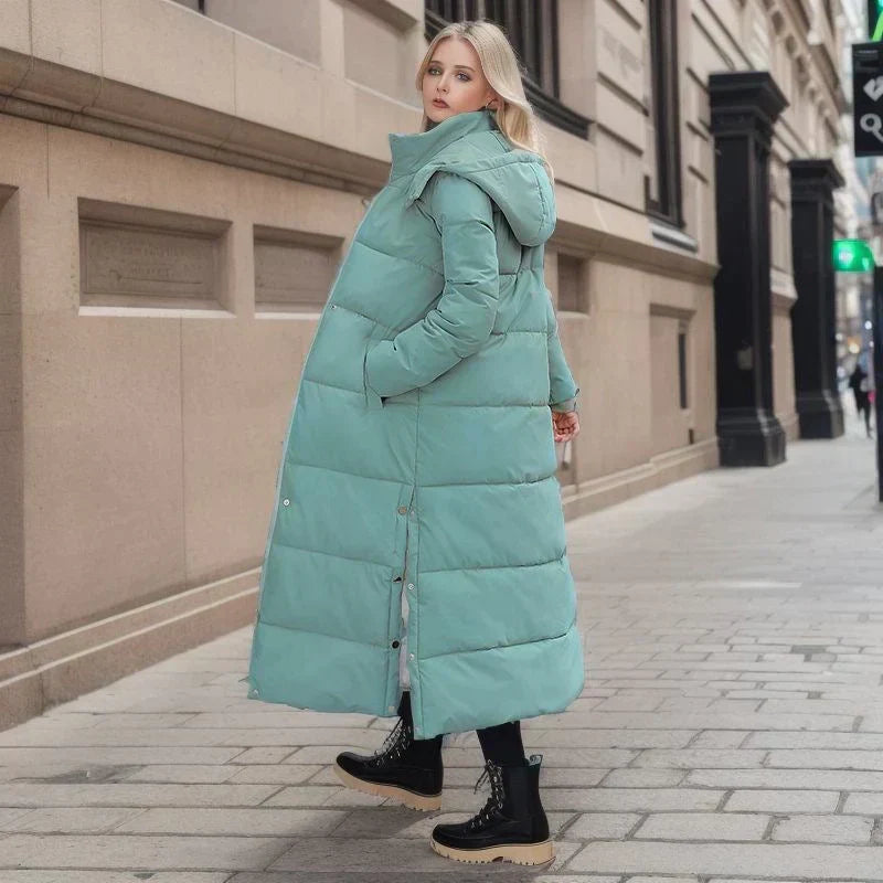 Woman modeling elegant Isabella long winter coat, a warm fashion statement for winter.