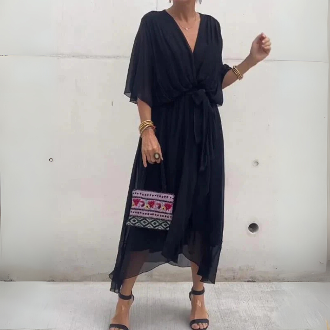 Lightweight women's spring/summer wrap dress with elegant flowy design and short sleeves.