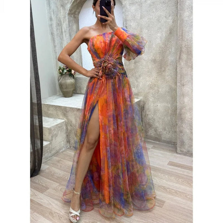 Sophisticated women's sheer floral maxi dress, an elegant long gown with an asymmetrical neckline for special events.