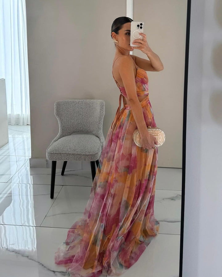 Printed elegant bodycon maxi dress, a women's summer staple. Features flowing silhouette & spaghetti straps.