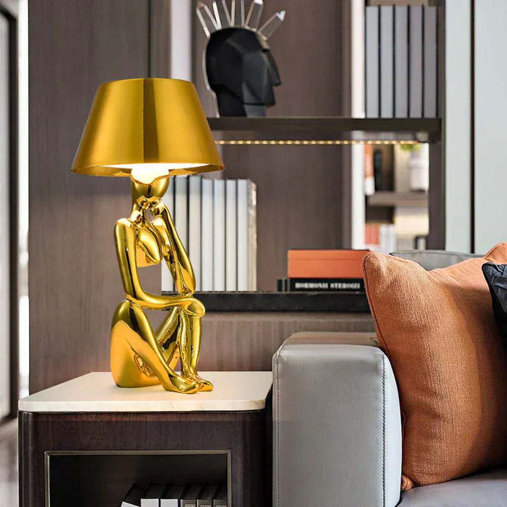 Elegant modern table lamp with gold base, perfect for living room ambiance.