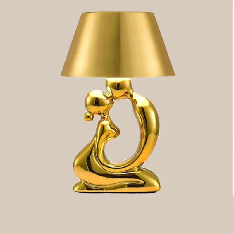Sleek designer table lamp in silver, ideal as a modern bedside lamp.