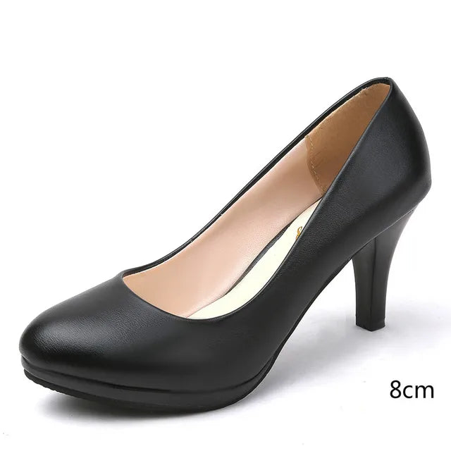 Women's black orthopedic pumps with supportive cushioning, ideal as comfortable high heels for work.