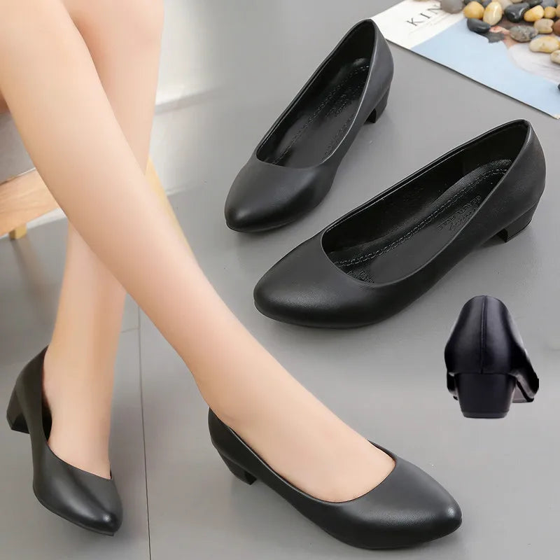 Professional women's black orthopedic pumps, comfortable and elegant work heels for formal occasions.