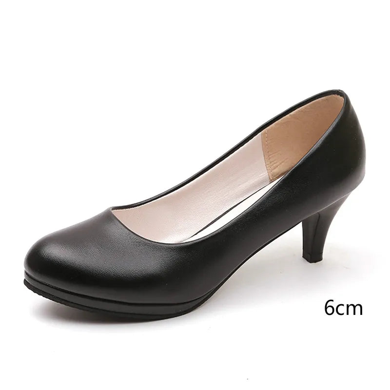 Women's elegant black orthopedic pumps, comfortable high heels perfect for dress & professional wear.
