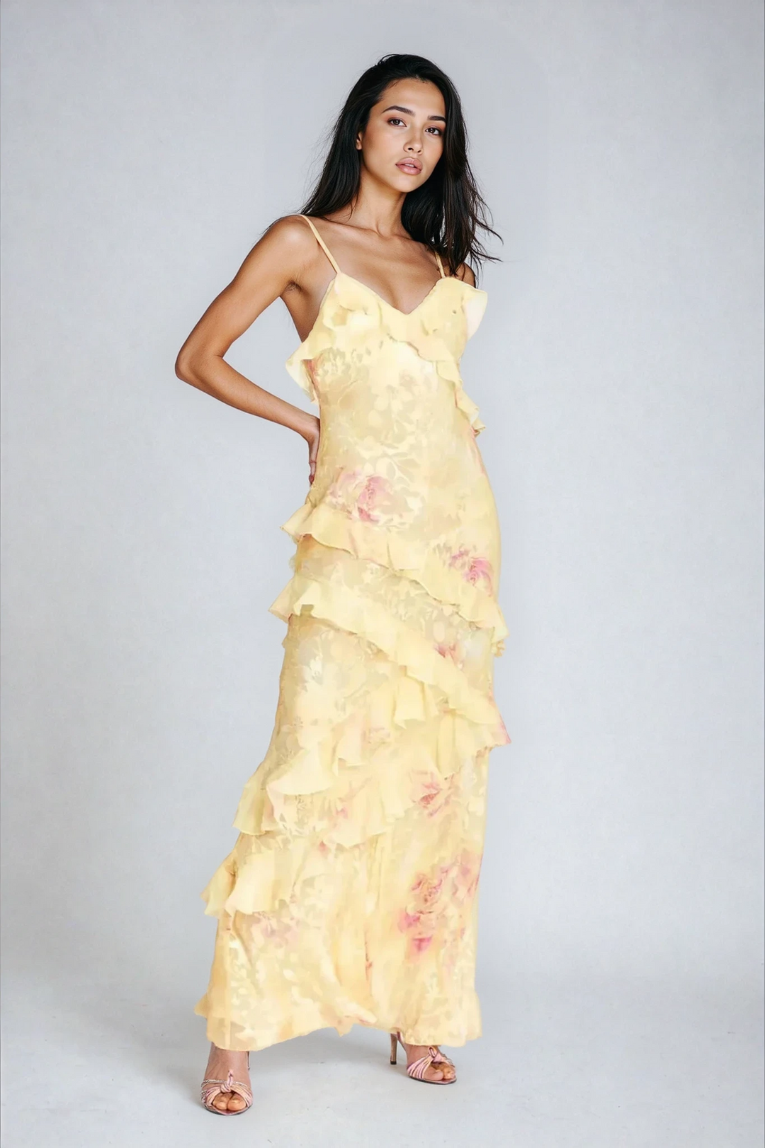 Elegant pink floral maxi dress with spaghetti straps and ruffles, perfect for summer events.
