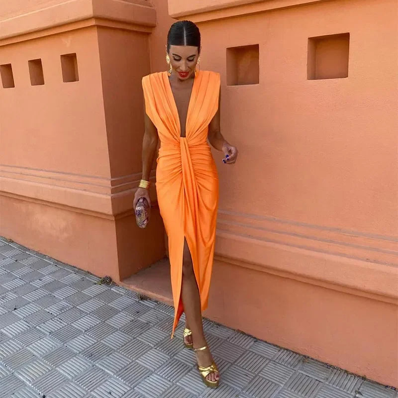 Elegant women's pleated maxi dress, perfect for summer occasions. Flowy long formal wear.