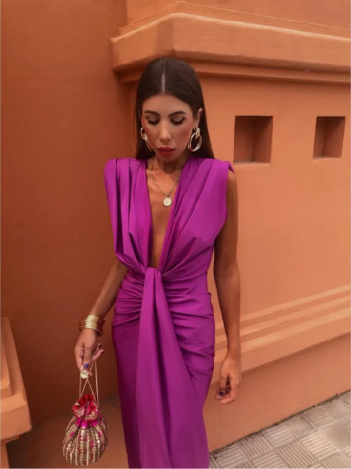 Stylish women's long pleated maxi dress for occasion wear. Elegant flowy summer formal dress.