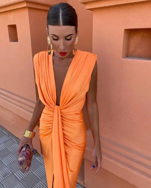 Beautiful pleated maxi dress for women. Elegant formal or summer occasion wear. Long flowy design.