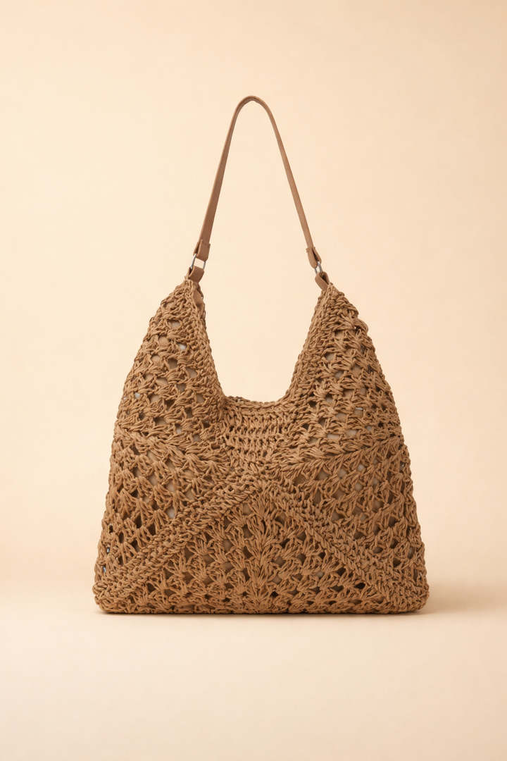 Women's bohemian woven raffia shoulder bag, perfect for summer or relaxed chic styling. Casual hobo tote.
