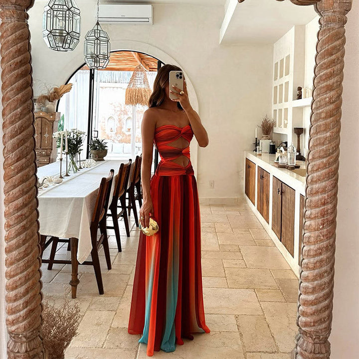 Full-length red formal dress, strapless design with elegant knot embellishment.