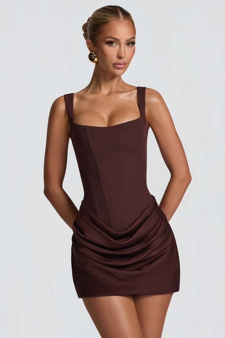 Fashionable short party dress with elegant ruching and a flattering bodycon fit.