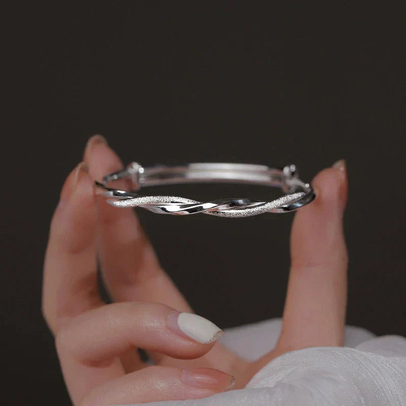 Intricate sterling silver bracelet for women, showcasing an elegant, timeless design. A sophisticated fashion accessory.