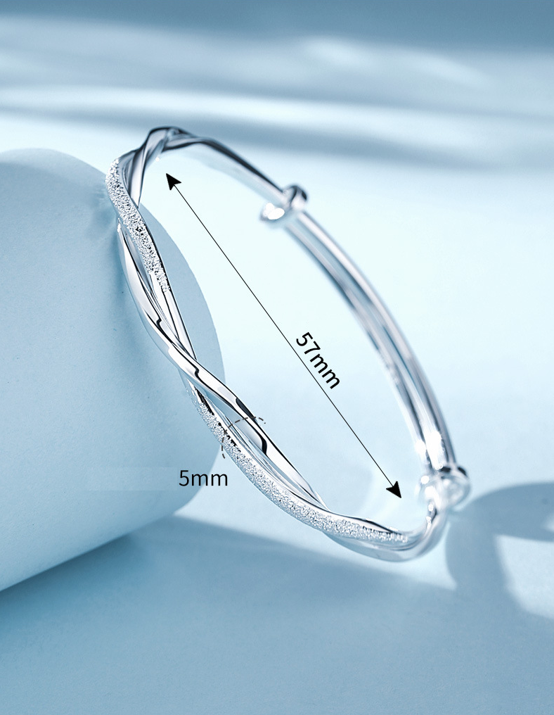 Handcrafted sterling silver bracelet for women, featuring an intricate, elegant design. High-quality fine jewelry.