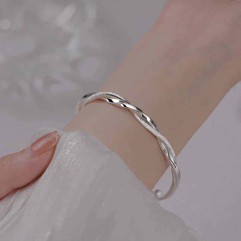 Elegant sterling silver bracelet for women, featuring an intricate, delicate design. Perfect fine jewelry accessory.