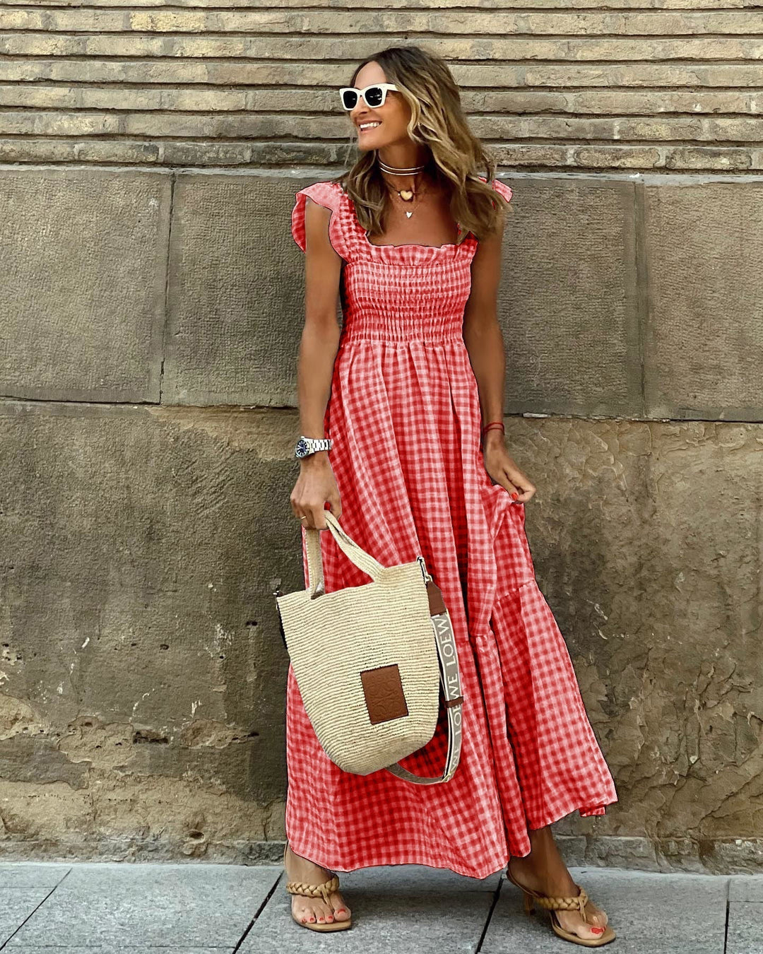 Occasion wear: elegant women's maxi dress. Smocked for comfort, with stylish ruffled sleeves. A flattering long dress.