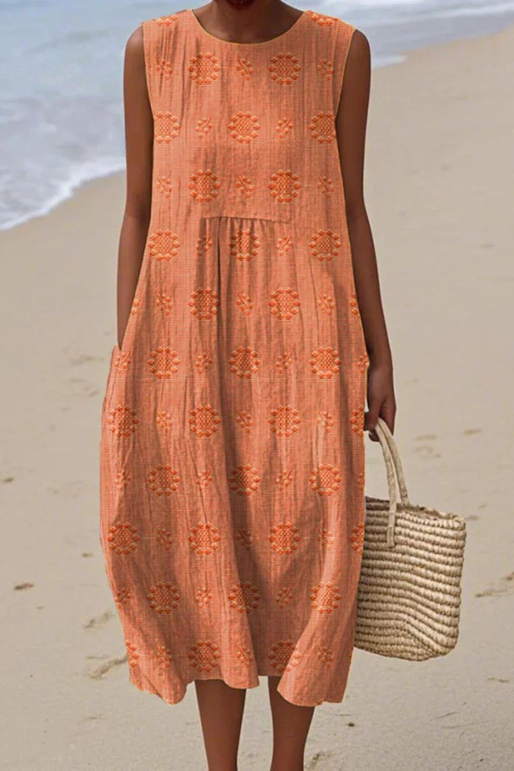 Feminine style: women's sleeveless midi dress featuring delicate embroidery