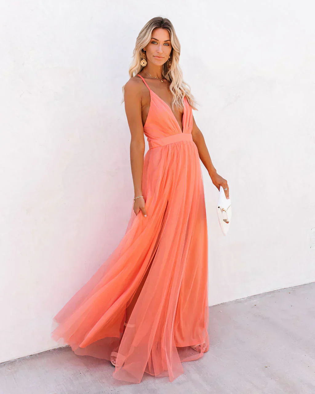 Elegant sleeveless V-neck women's flowy summer maxi evening dress.