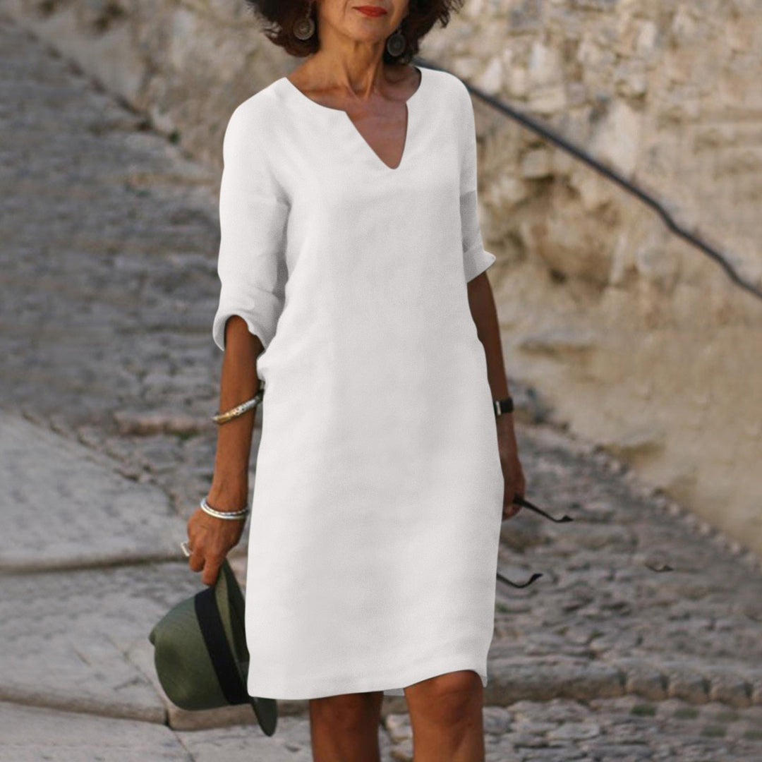 Women's elegant V-neck midi summer dress, comfortable and flowy for everyday casual or vacation.
