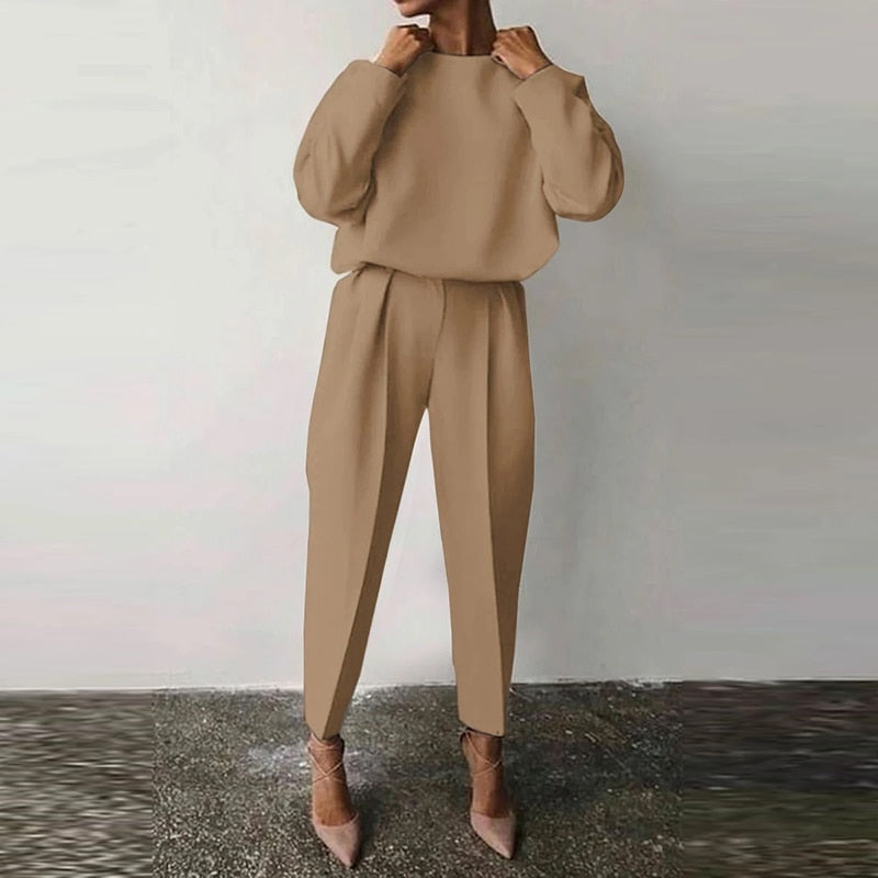 Stylish women's two-piece suit set. Versatile for office, casual outings, or elegant coordinated wear.