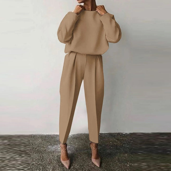 Stylish women's two-piece suit set. Versatile for office, casual outings, or elegant coordinated wear.