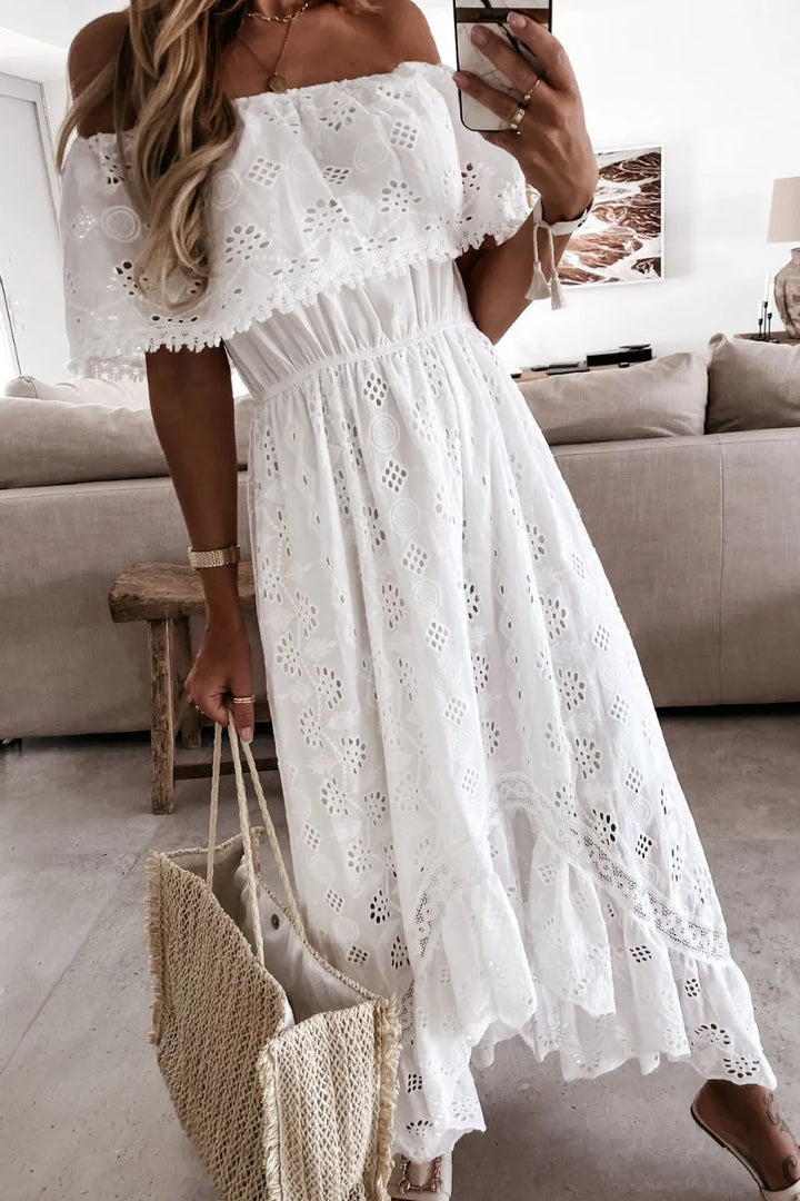 Beautiful women's white off-shoulder dress with intricate lace detail.