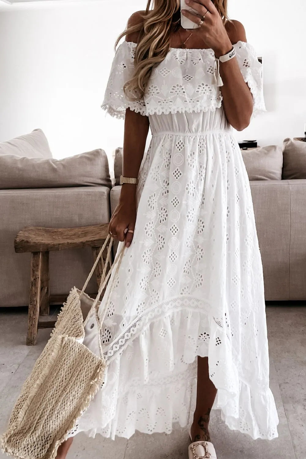 Summer wedding guest dress: white lace off-shoulder high-low style.