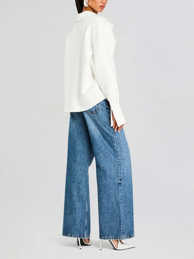 Classic elegant women's white button-down shirt with a draped design, a timeless long sleeve blouse for any occasion.
