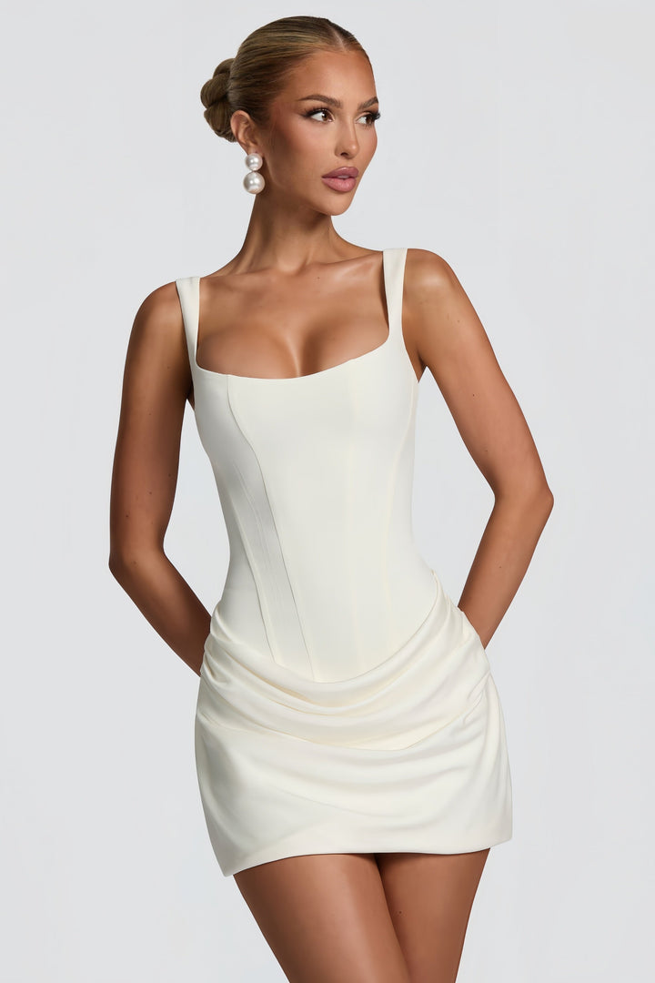 Stylish women's white bodycon mini dress with elegant ruching. Short, form-fitting evening & cocktail dress.