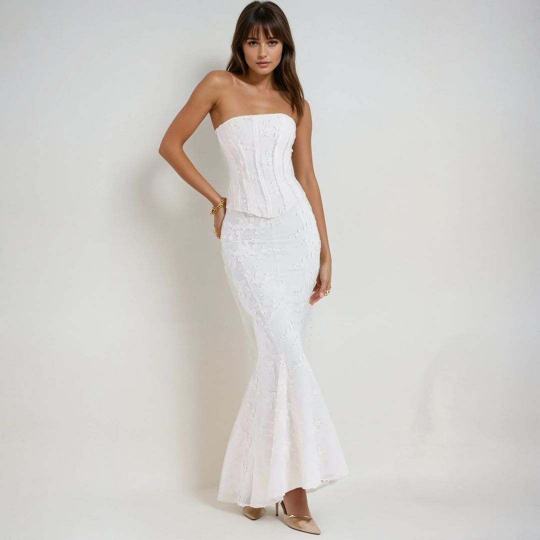 Elegant white strapless embroidered maxi dress, perfect for wedding guests.
