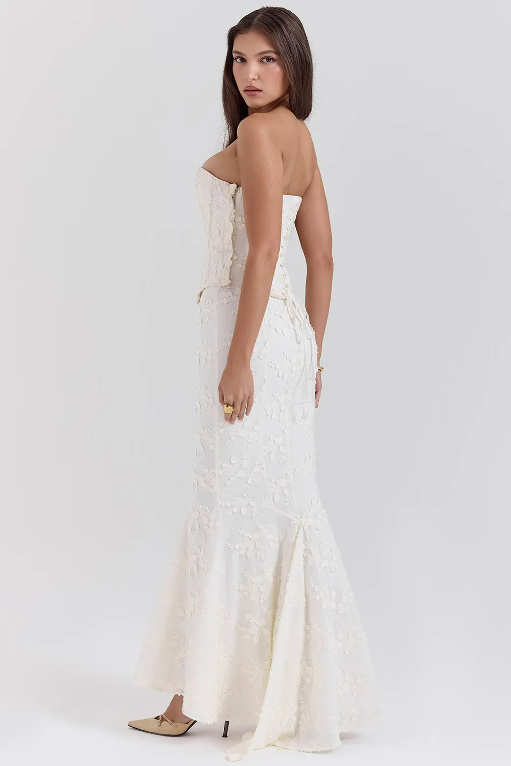 Wedding guest maxi dress in white, featuring a strapless design and delicate embroidery.