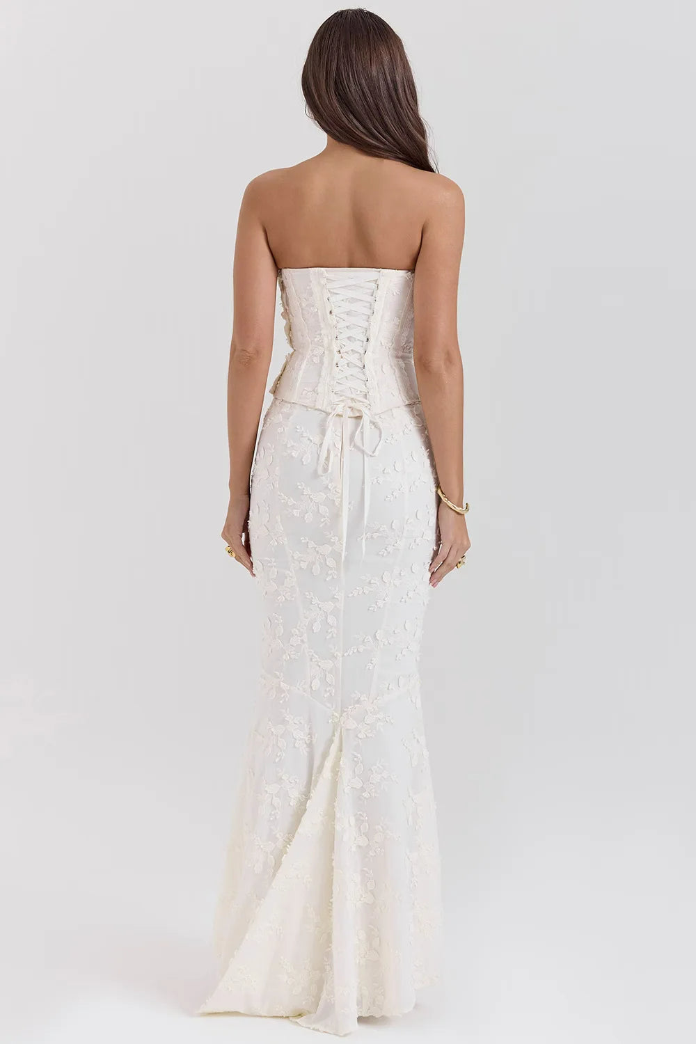 Sophisticated white embroidered strapless maxi dress for elegant formal events.
