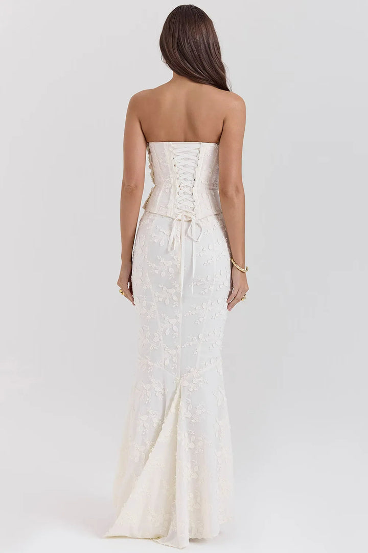 Sophisticated white embroidered strapless maxi dress for elegant formal events.