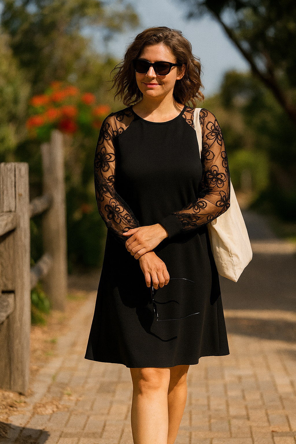Women's formal A-line evening gown with delicate sheer embroidered sleeves, ideal for special occasions.
