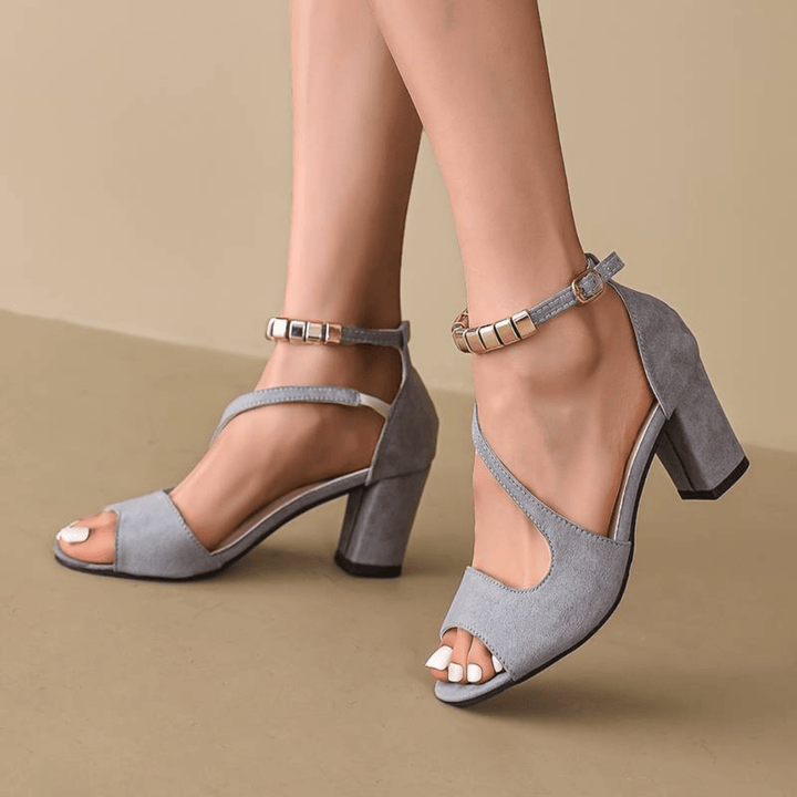 Comfortable women's block heel sandals. Elegant strappy design in black for versatile summer fashion and stability.