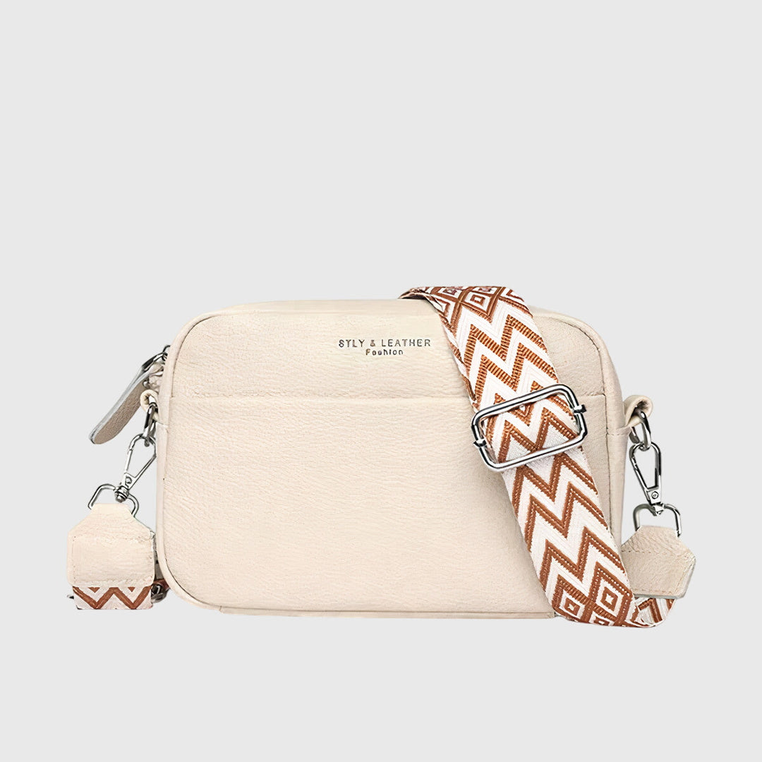 Classic women's elegant leather handbag, a sophisticated and organized shoulder bag for any occasion.