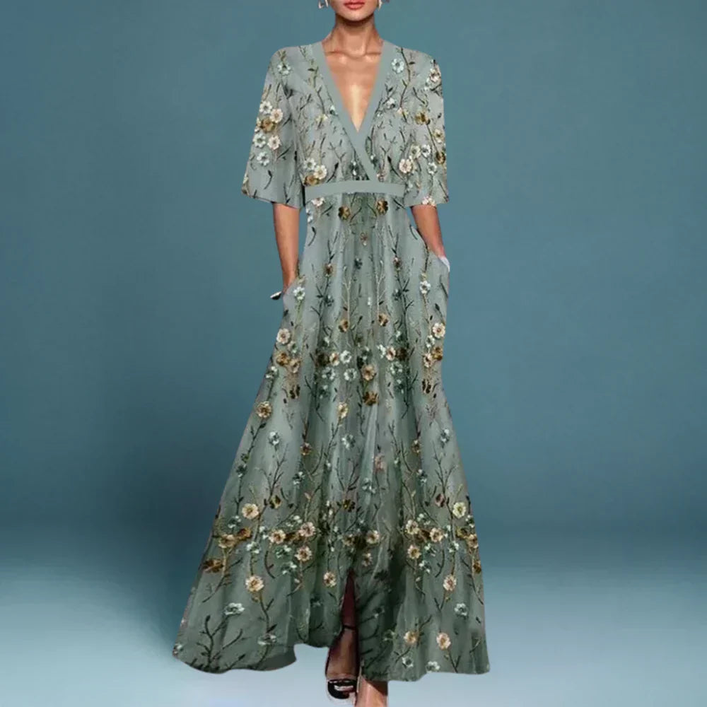 Elegant women's blue & white floral maxi dress, flowy & flattering, perfect for summer casual or occasion wear.