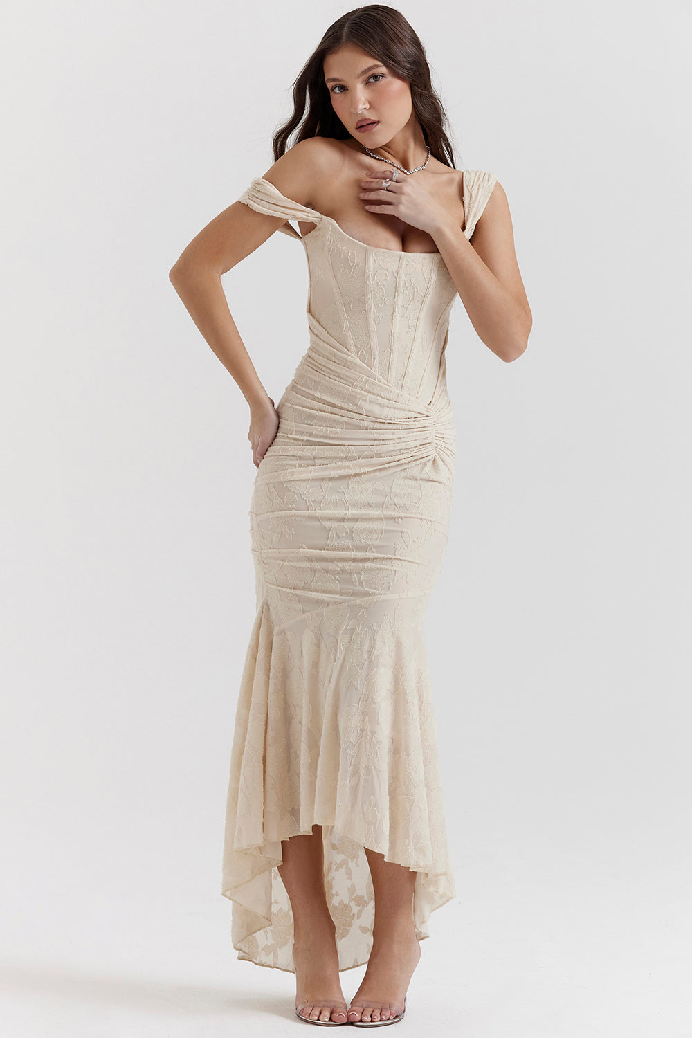Side profile of a graceful women's ruched corset maxi dress, perfect as a formal evening gown.