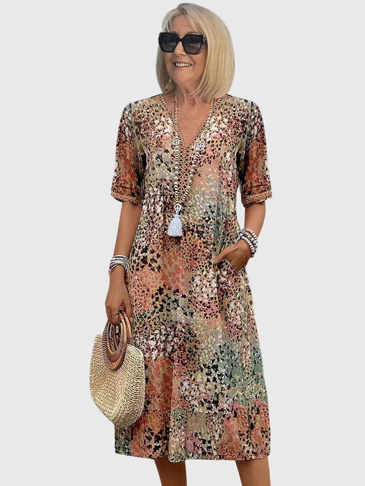 Fashionable women's midi dress with a vibrant floral print.